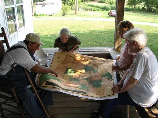 A team from New South Associates reviews historic map.